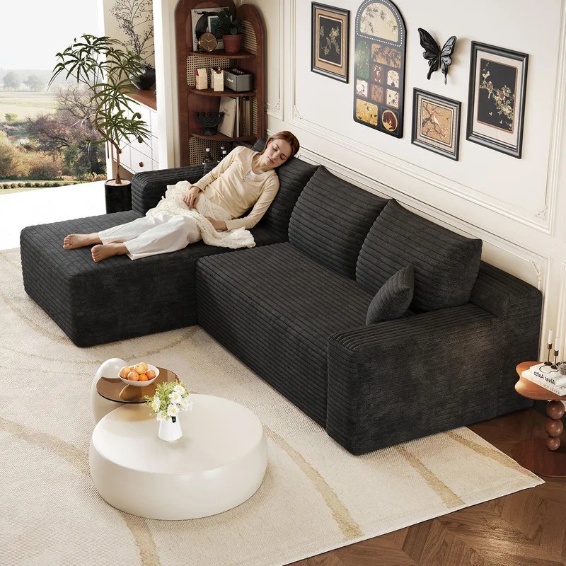 Sofá esquinero de terciopelo negro con chaise y cama
